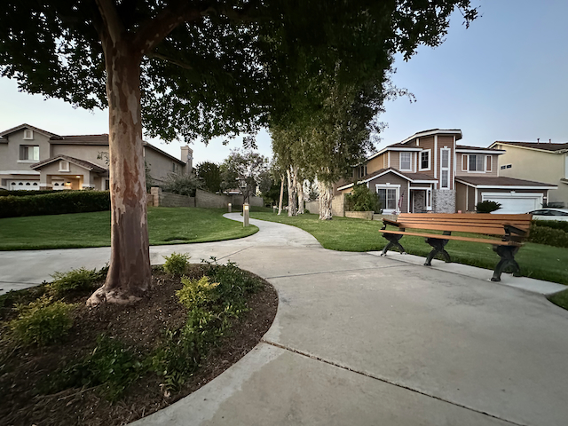 walkway with bench Threewoods Community - 1